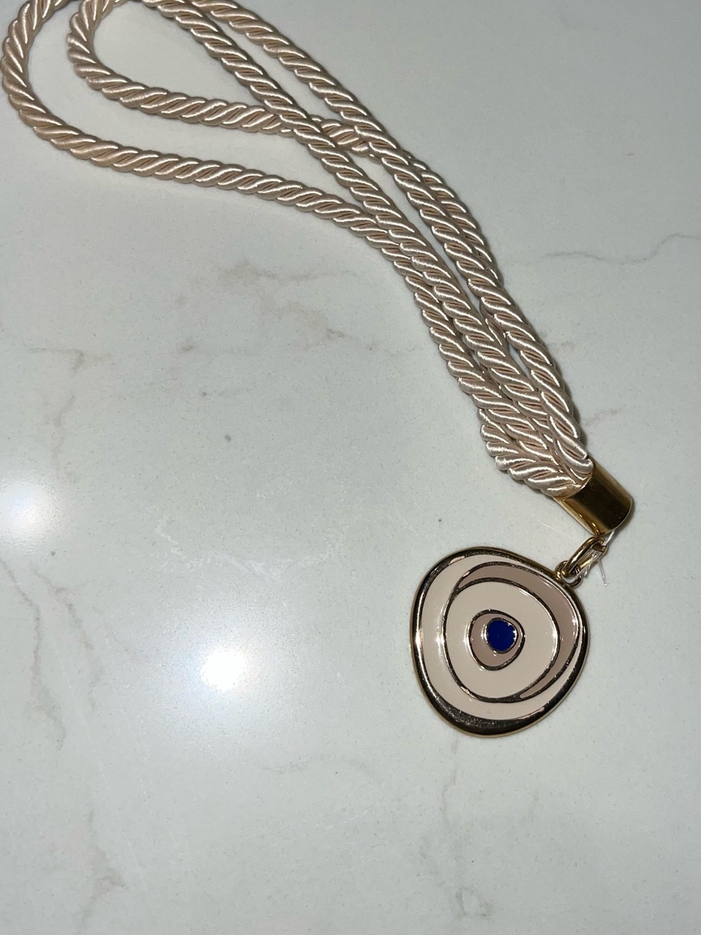 Elegant Cream Rope Evil eye pendant decor with Gold Accent